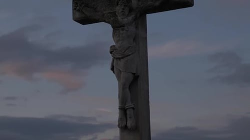 Stone Sculpture of Crucifixion at Sunrise