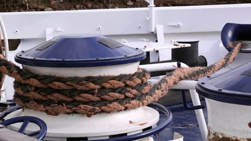 Rope Wrapped Around Blue and White Boat Winch