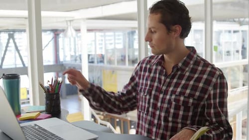 Young man working in a creative office