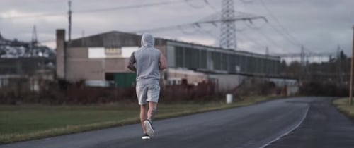 Man Running on a Rural Road