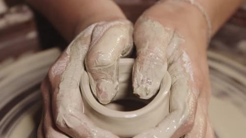 Pottery Workshop Wet Female Hands Shaping the Clay on the Wheel
