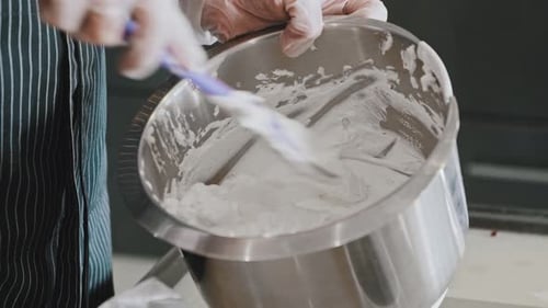Filling being mixed in stainless steel bowl