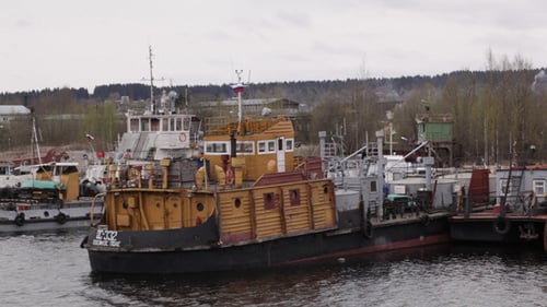 Old Repair And Freight Ships At Berth