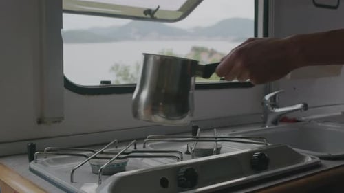 Cooking in a Camper Van with a Water View