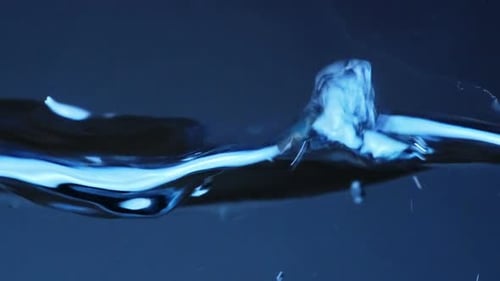 Rippling Water Surface in Dark Blue Background