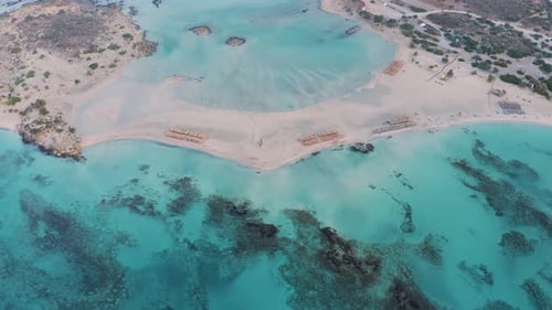 Water color is Aqua Menthe. Flying above beach. Aerial view of beautiful sandy beach