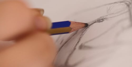 Hand Drawing with a Pencil Close Up