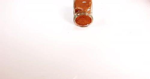 Nutmeg, myristica fragans, Powder falling against White Background, Slow Motion 4K