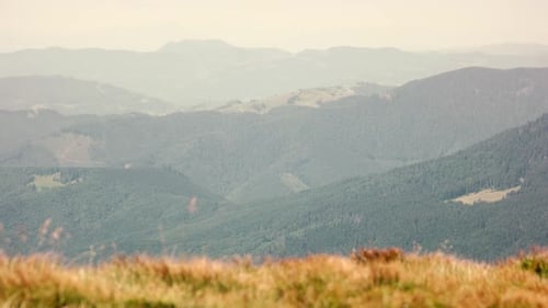 Scenic Mountains and Rolling Hills Landscape