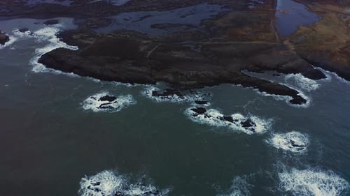 Aerial Seascape of a Volcanic Black Sand Beach and Eystrahorn Mountain Iceland