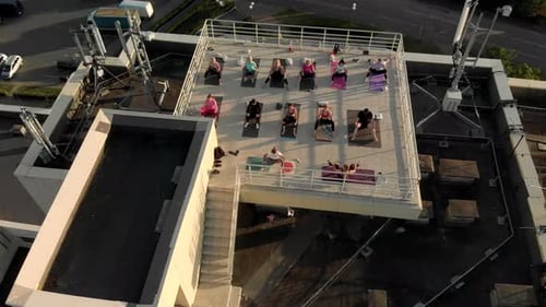 Yoga Class on a Building Rooftop Aerial View