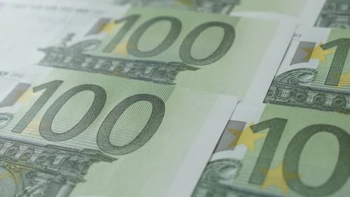 Hundred euro banknotes shallow DOF slow pan 4K 2160p 30fps UltraHD footage - Close-up of European U
