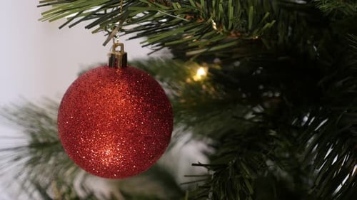 Festive Red Christmas Ornament on Tree