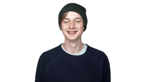 in Slow Motion Portrait of Cheerful Teenage Boy in Braces Wearing Hat Laughing Smiling on Camera