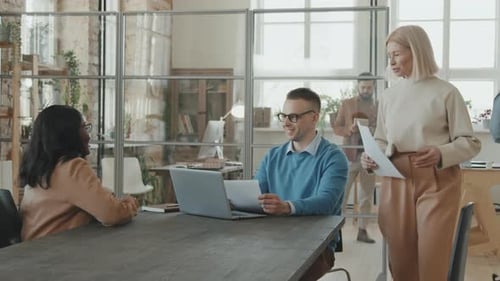 Professionals Collaborating in Modern Open Office