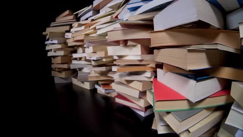 Chaotic Stack of Books on Dark Surface