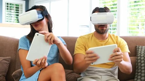 Couple Enjoys VR Gaming With Tablets at Home