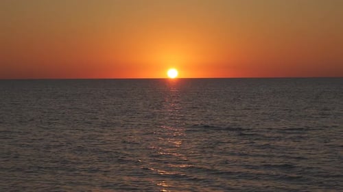 Beautiful Sunset on the Sea. Orange Sunset. Sunset with Sea View. Yellow-red Sun Going Into the Sea