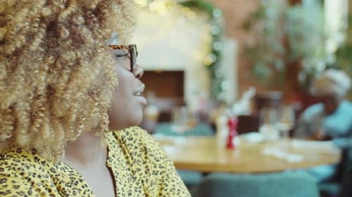 Black Man and Woman Talking in Cafe
