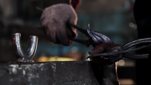 Blacksmith Shaping Red Hot Metal on Anvil