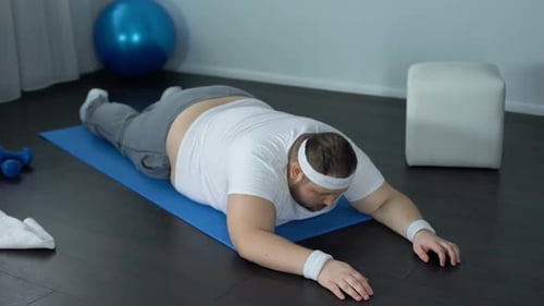 Man Doing Superman Yoga Pose at Home