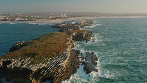 Aerial View of Unique Landscape with Rocky Cliffs Washed with Foamy Waves