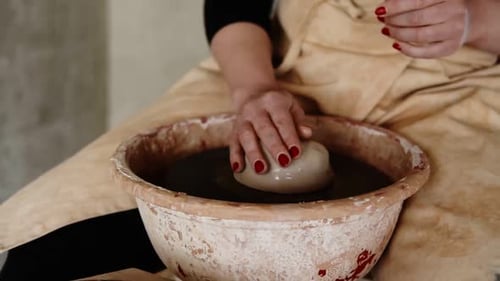 Female Artist Potter in the Workshop Creating a Ceramic Product