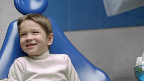 Child Smiles During Dental Exam at the Dentist