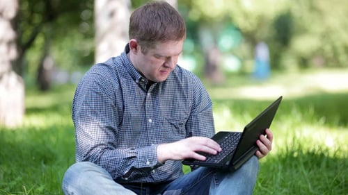 Businessman Working In The Park