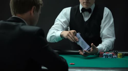 Dealer Shuffles Cards in High Stakes Casino Game