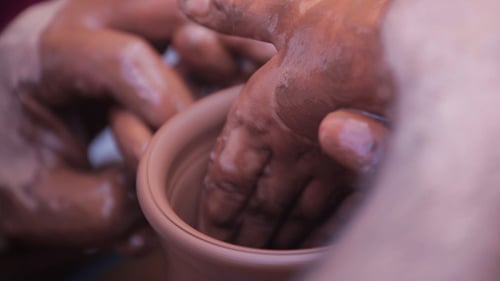 Potter Shaping Clay to Form Beautiful Pot