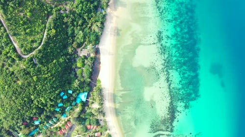Wide angle aerial abstract view of a white sandy paradise beach and aqua turquoise water background