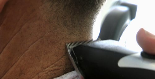 Razor Trimming Hair on Back of Neck