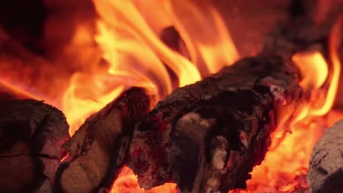 Close-Up of Fireplace Flames with Burning Wood