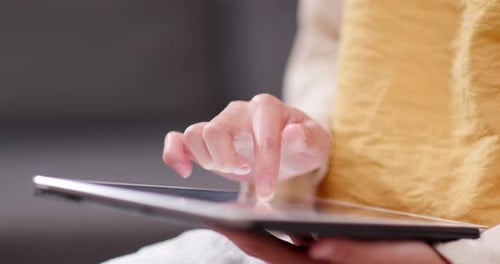 Woman use of tablet computer at home