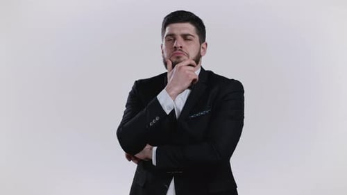 Man in Suit Thinking Seriously