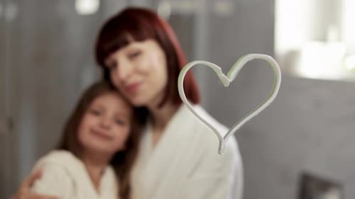 Loving Mother and Child Embracing in Bathroom
