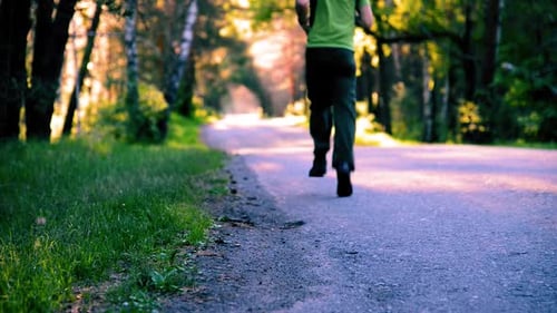 Sport Man Running at Asphalt Road