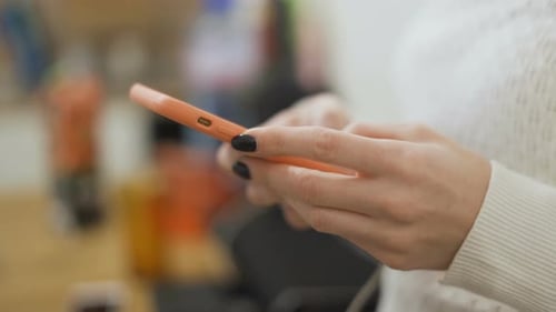 Woman Using Cell Phone Close Up Indoor