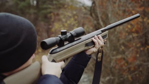 Hunter holding hunting rifle