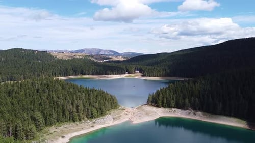 Aerial View of Mountainous Surface with Coniferous Forest and Skyblue Lakes Inside