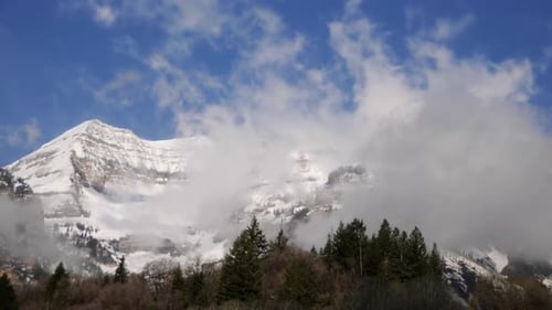 Timelapse shot of clouds blowing over Mt, Timpanogos, UT