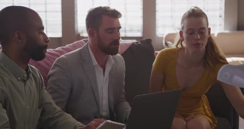 Young creative professionals working in a modern office