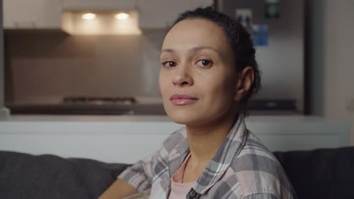 Woman Turns to Look Directly at the Camera