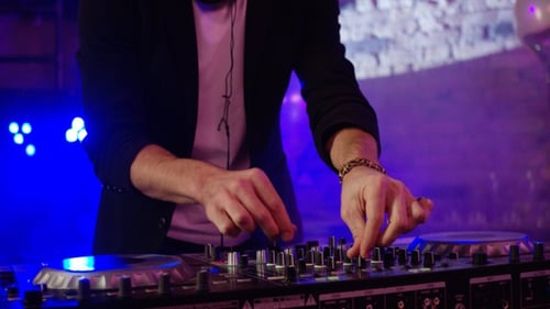 Dj Playing at a Nightclub