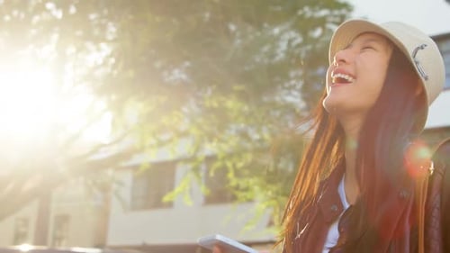 Woman using mobile phone in city street 4k