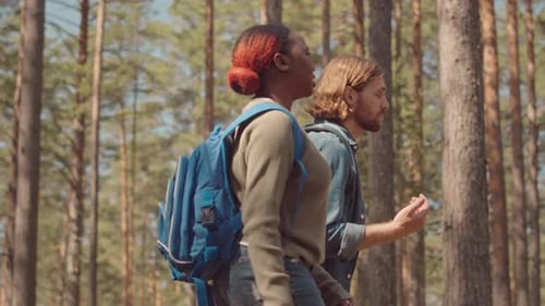 Multiethnic Couple Walking in Forest