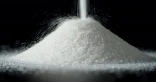 Sugar Is Poured on the Table in a Pile