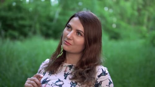 Beautiful Girl Stands in the Forest with Summer Sunny Weather