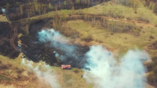 Aerial View of a Rural Wildfire with Firetruck